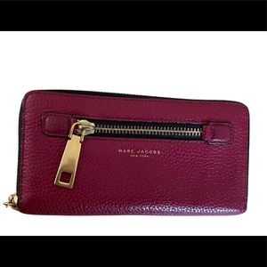 Marc Jacobs Pebbled Leather Wallet in the Color BlackBerry with Gold Hardware.